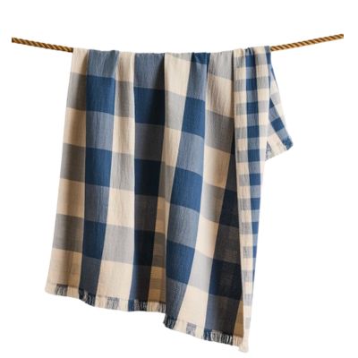 blue and white blanket hanging on a line