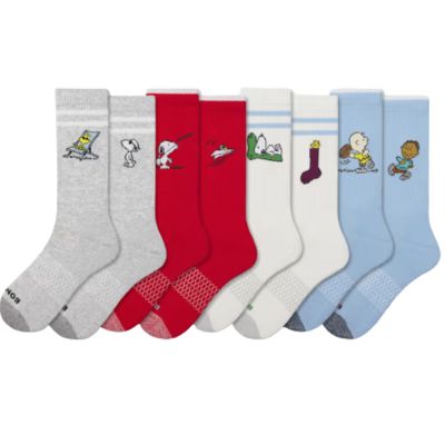 4 pair of socks with peanuts characters on them