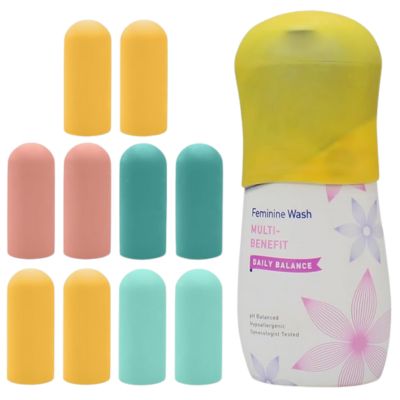 bottle with cover on it and multiple colored covers next to it